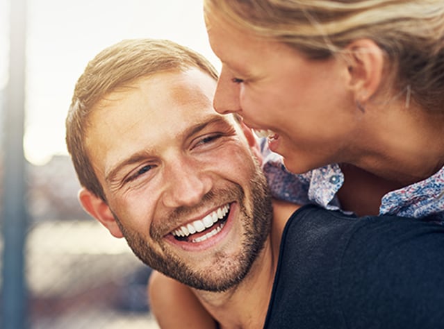 Smiling young couple having great time, happy after Canesten thrush treatment